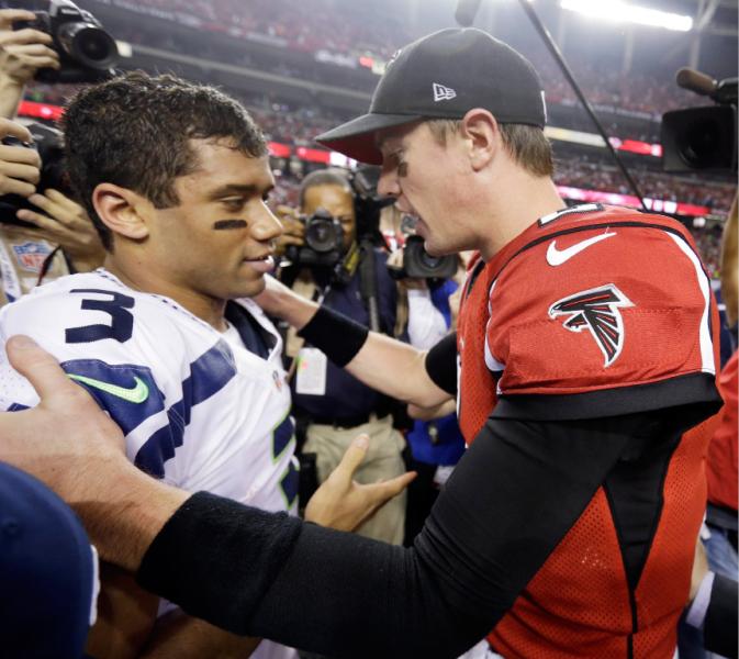 Matt Ryan and Russell Wilson meet after the Falcons 30-28 victory over Seattle