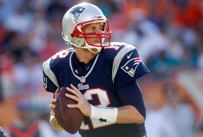 New England Patriots Quarterback, Tom Brady, was suspended four games for his part in #DeflateGate  (AP Photo/John Bazemore)