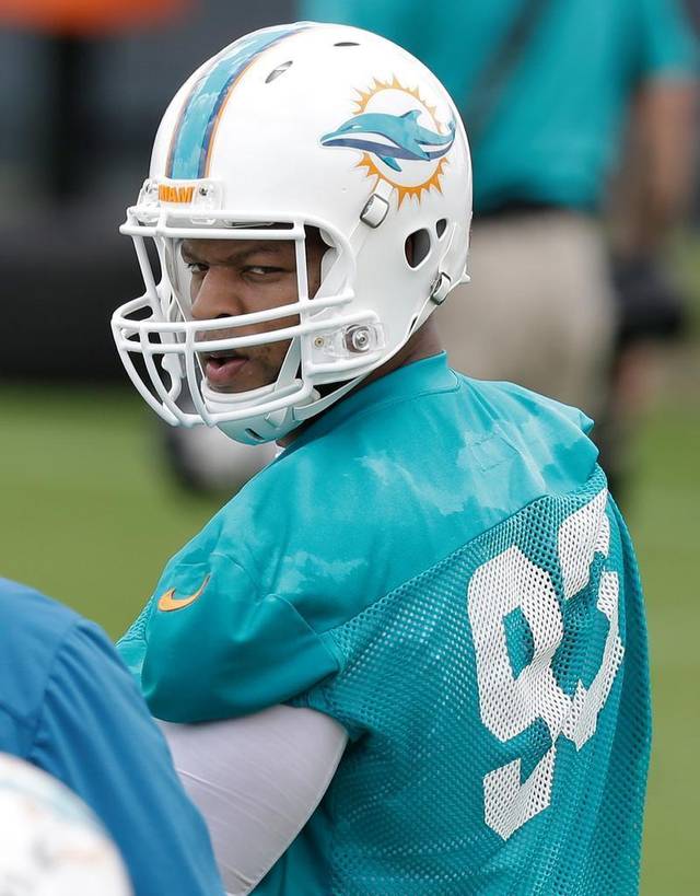 Suh took his talents to South Beach, and brought new expectations for 2015 with him. (Photo By/Wilfredo Lee, AP)
